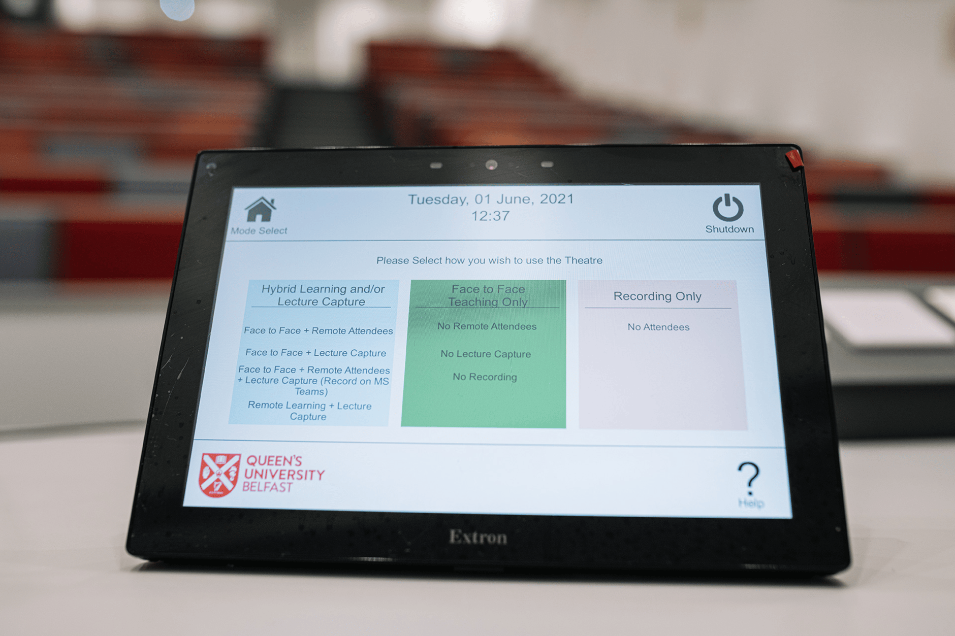 Extron control panel at Queen's University Belfast displaying lecture options.