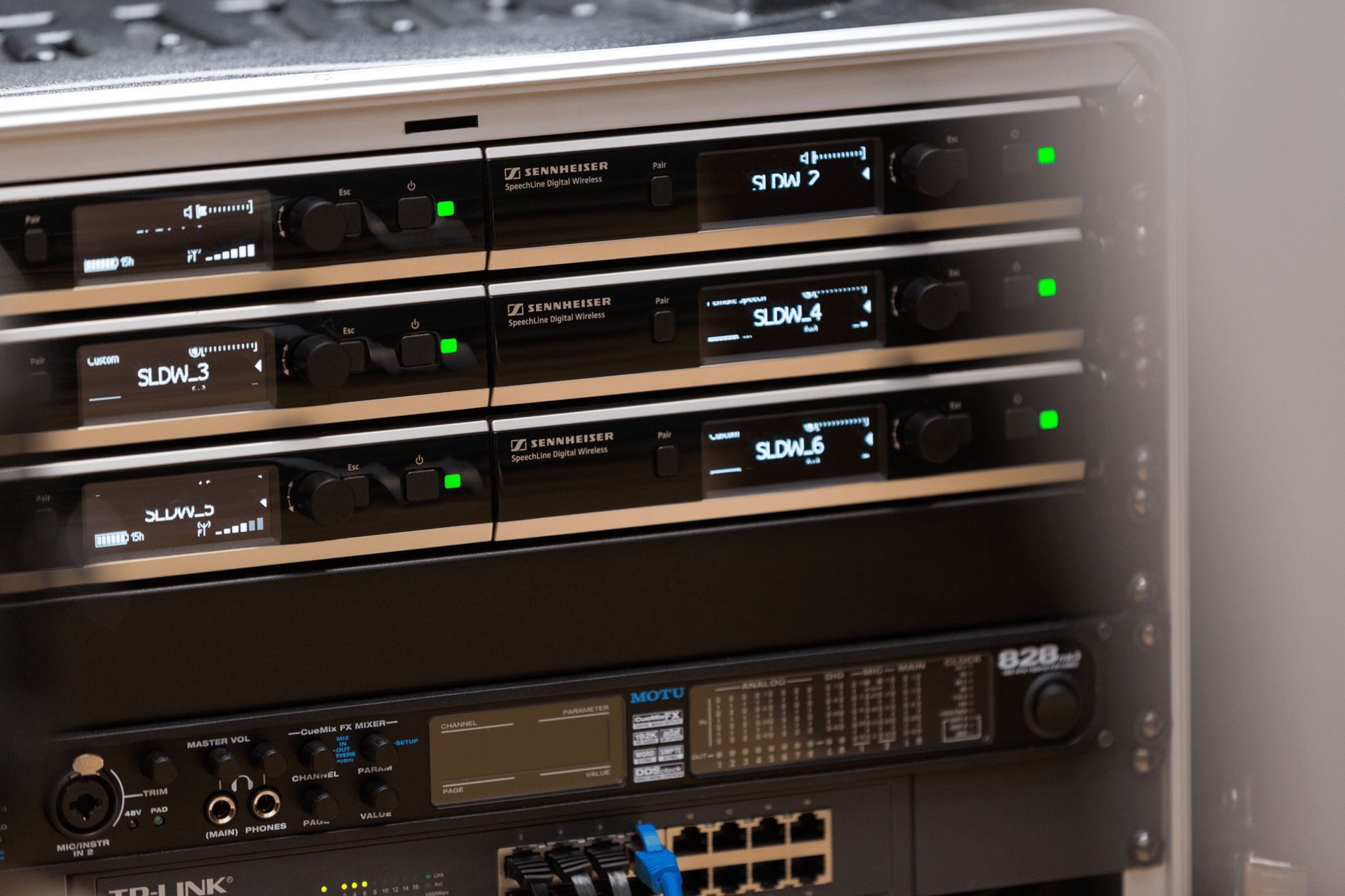 Sennheiser wireless microphone system integration setup in a rack.