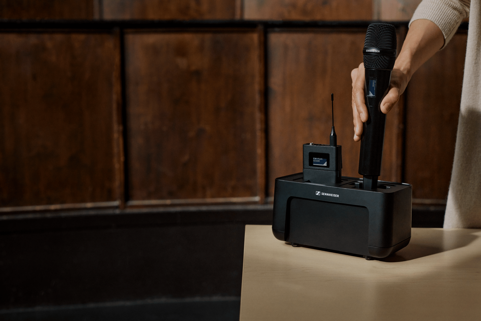 Sennheiser EW-DX UHF wireless microphone system on a table.