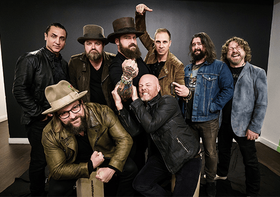 Group photo of the Zac Brown Band members posing together.