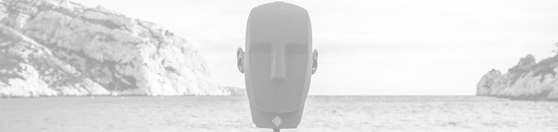 Neumann KU 100 binaural dummy head microphone with coastal background