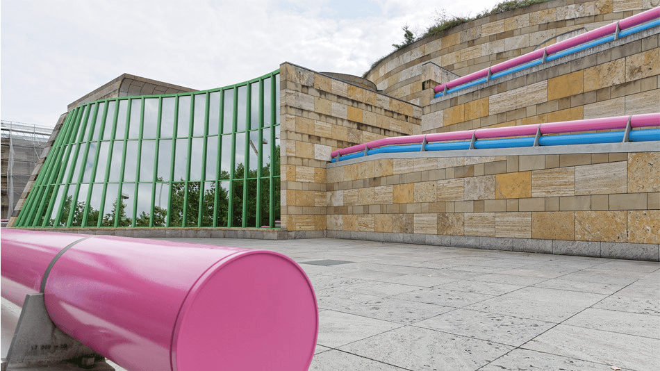 Staatsgalerie Stuttgart modern architecture with colorful pipes and glass facade.