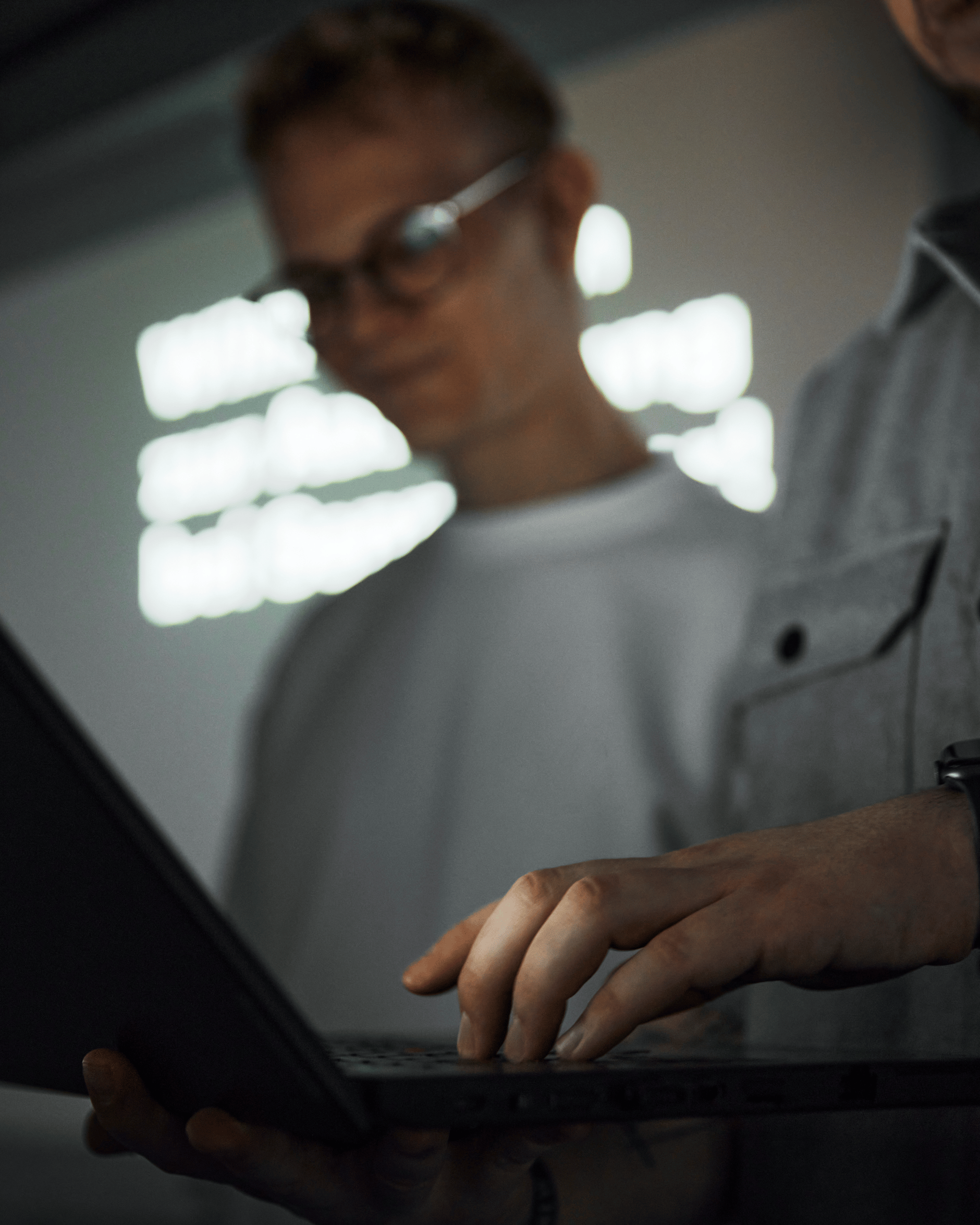 Person using a laptop during a vocational training session at Sennheiser.