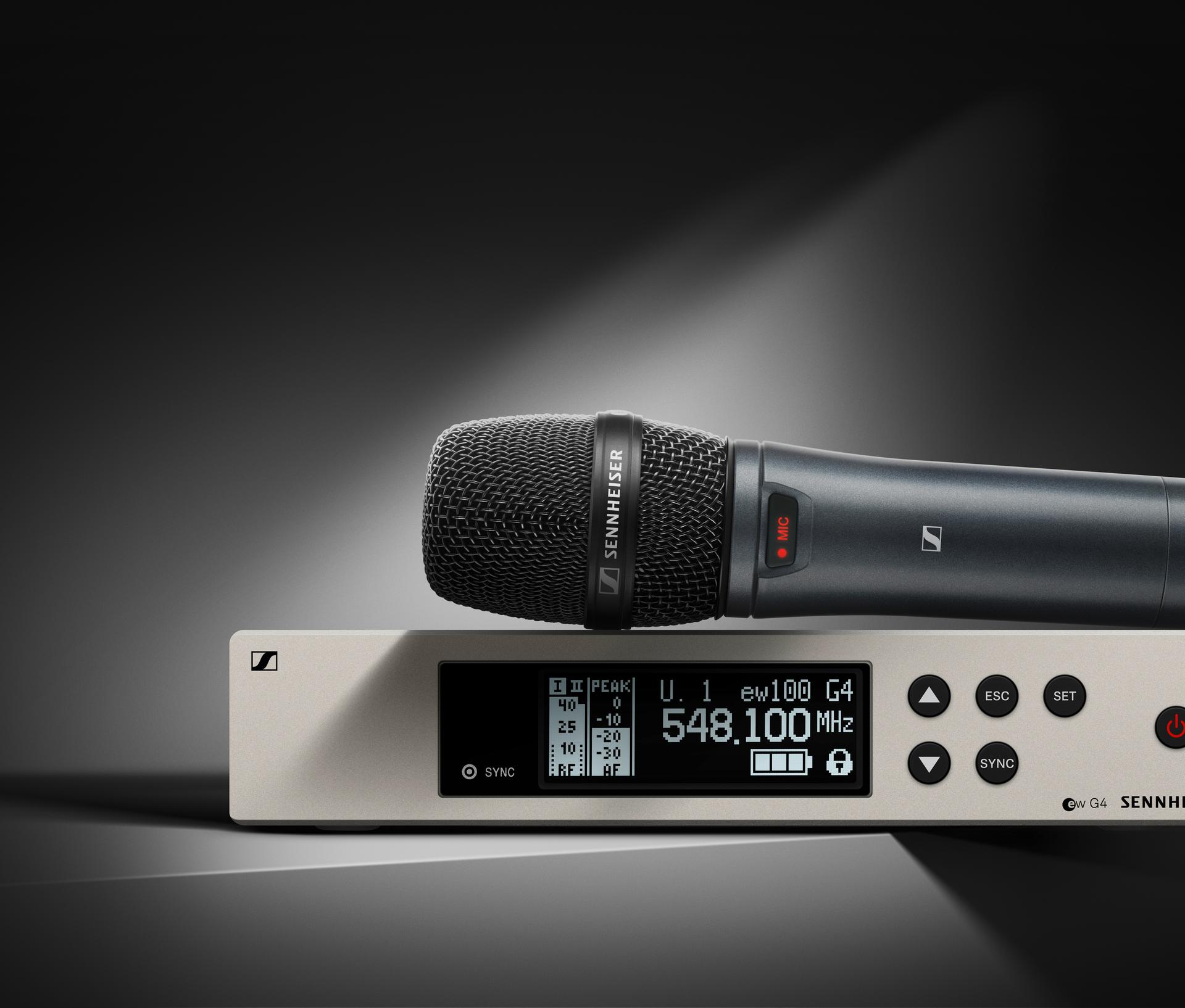Sennheiser G4 wireless microphone system with receiver displaying frequency.