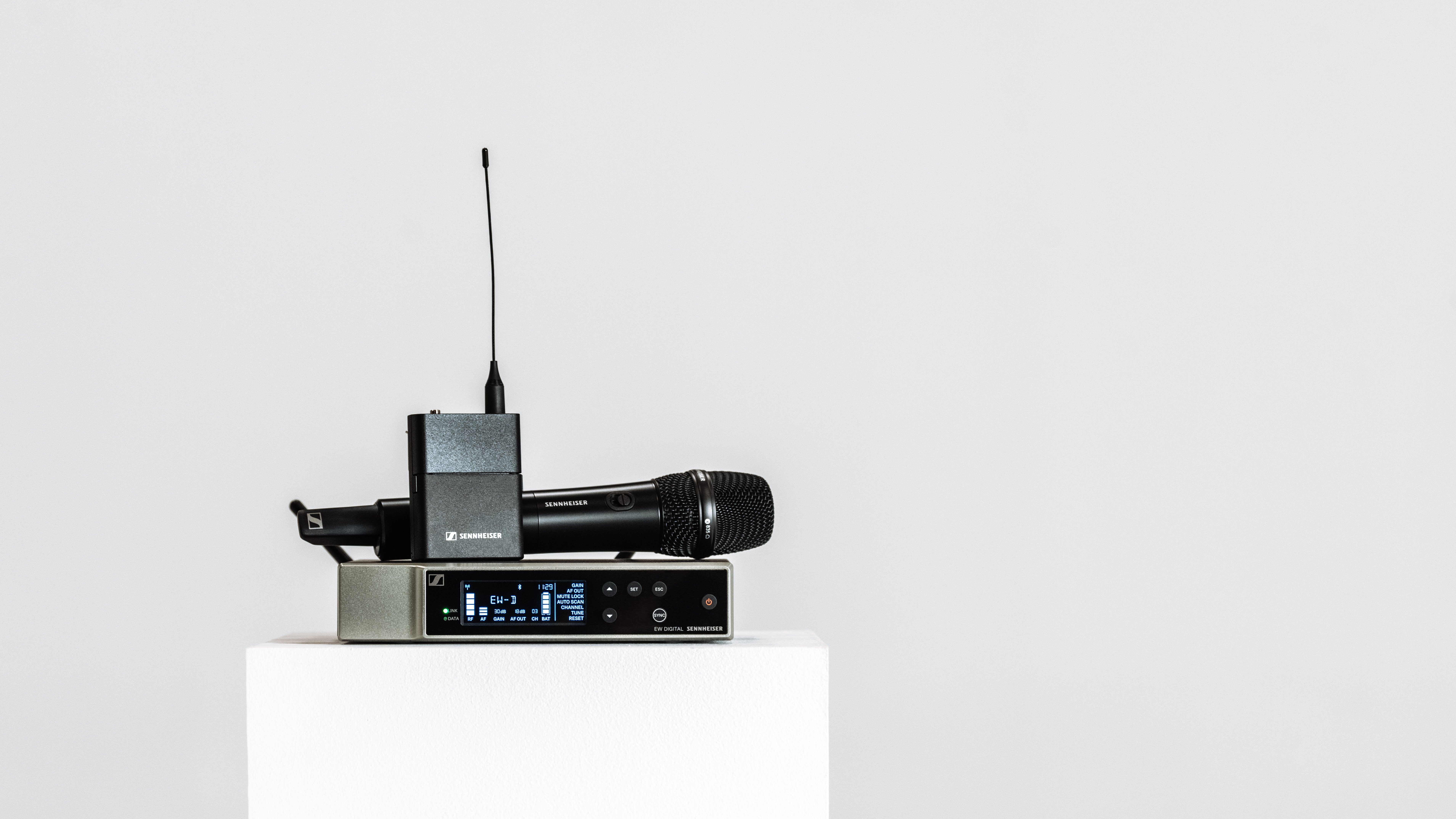Sennheiser Evolution Wireless Digital microphone system on a white pedestal.
